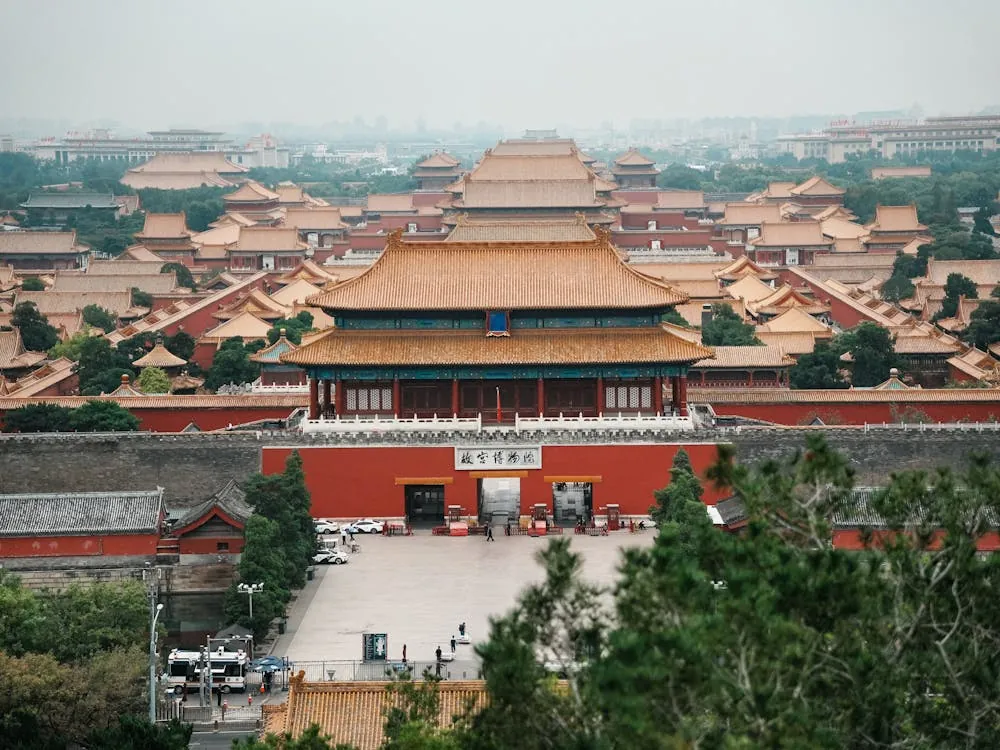 Stunning aerial shot of the Forbidden City in Beijing, showcasing traditional Chinese architecture and cultural heritage.