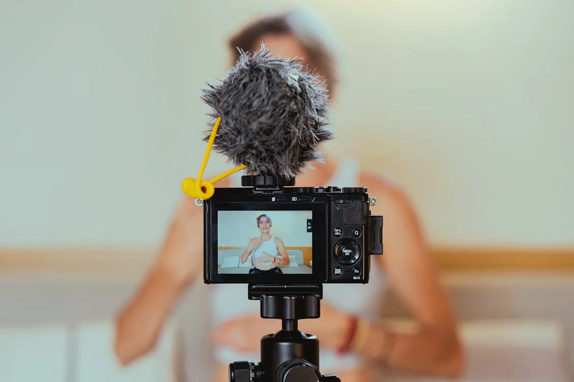 A creator being filmed on a camera setup for video content