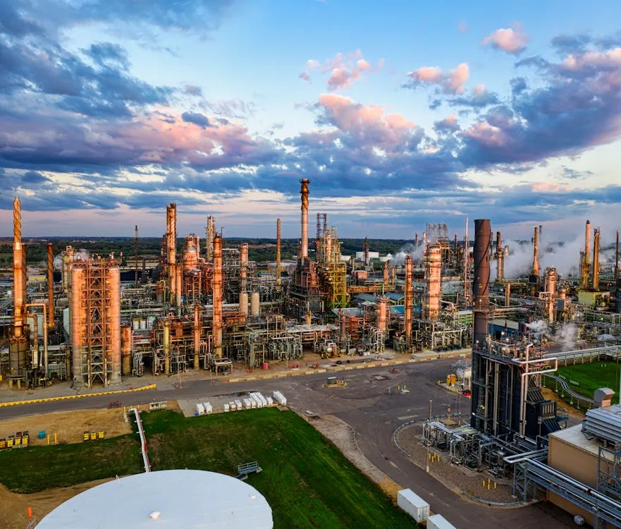Oil refinery and energy infrastructure at sunset