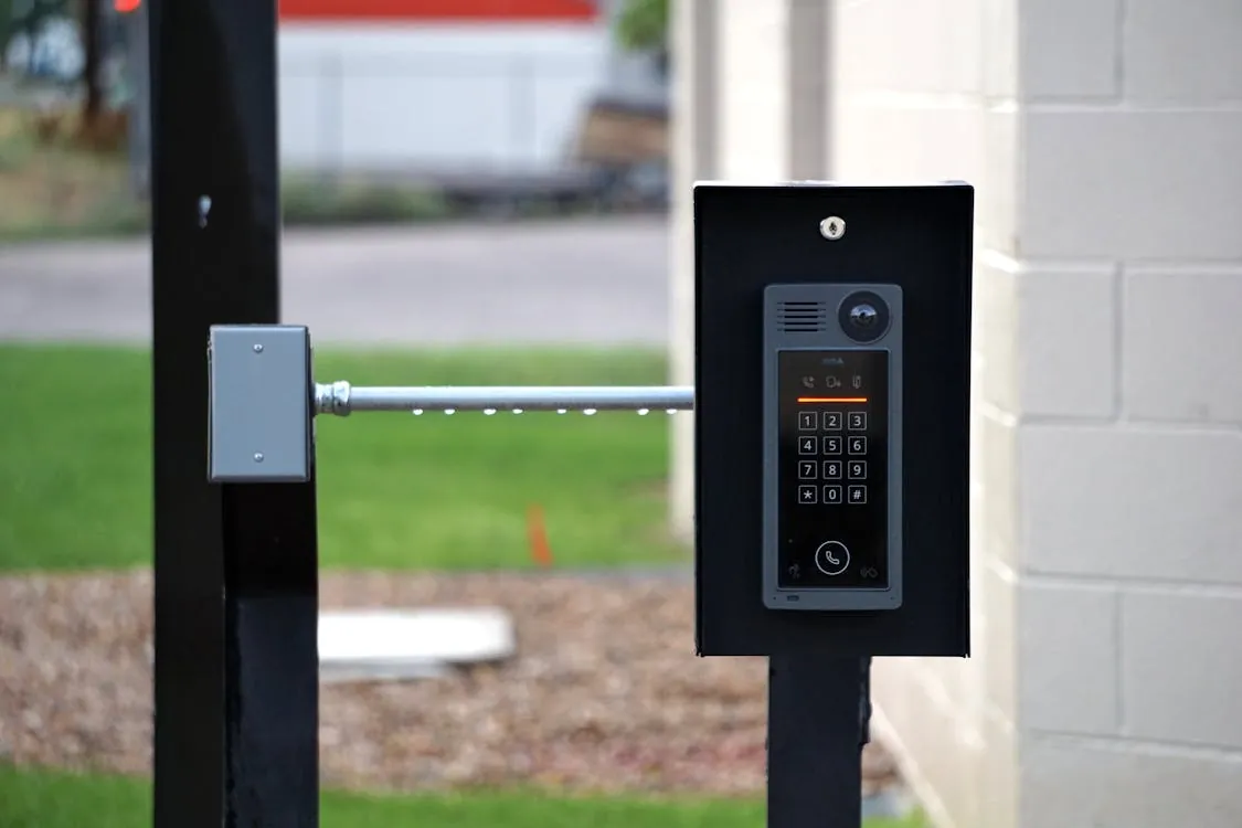 Outdoor intercom mounted at a residential building entrance, representing the contrast between legacy intercom systems and modern smart home technology.