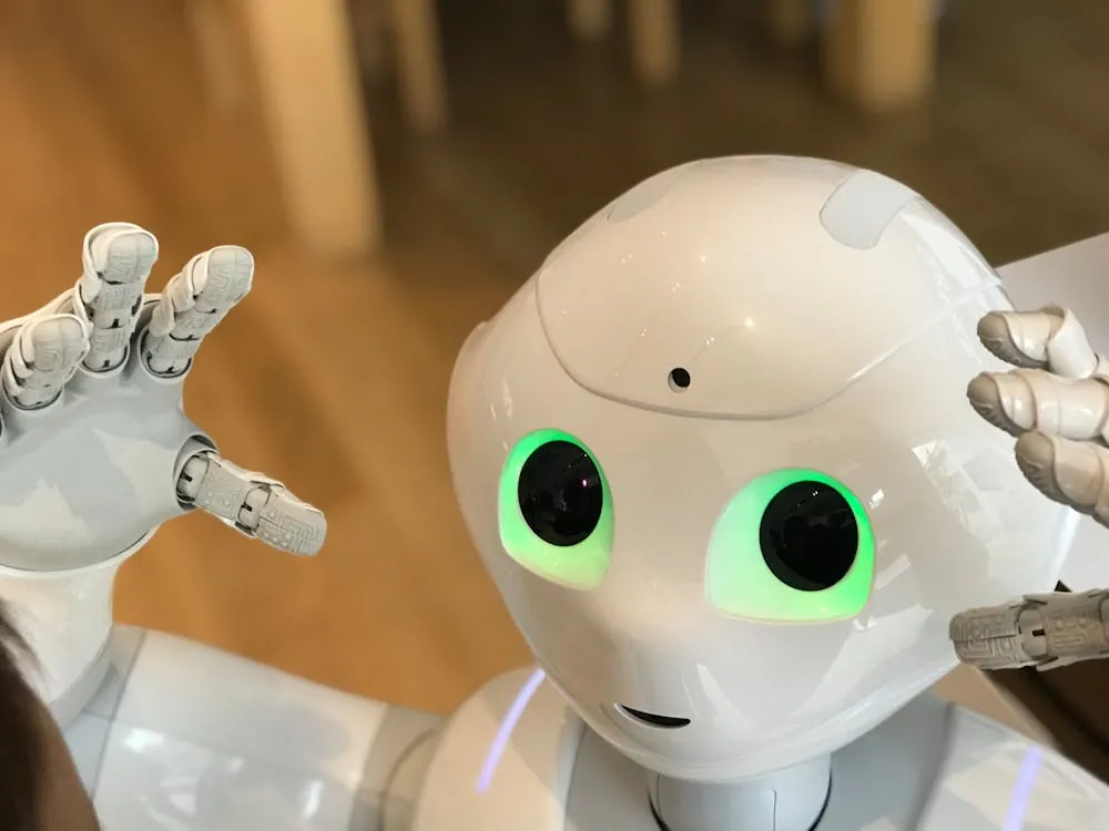 A futuristic humanoid robot with glowing green eyes in a modern setting, representing advanced AI infrastructure and machine learning compiler breakthroughs in 2026.