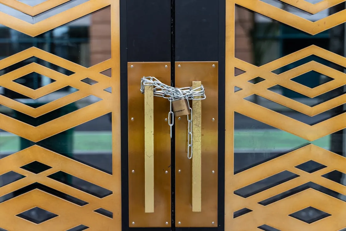 A stylish geometric door locked with a chain, symbolizing modern security and protection.
