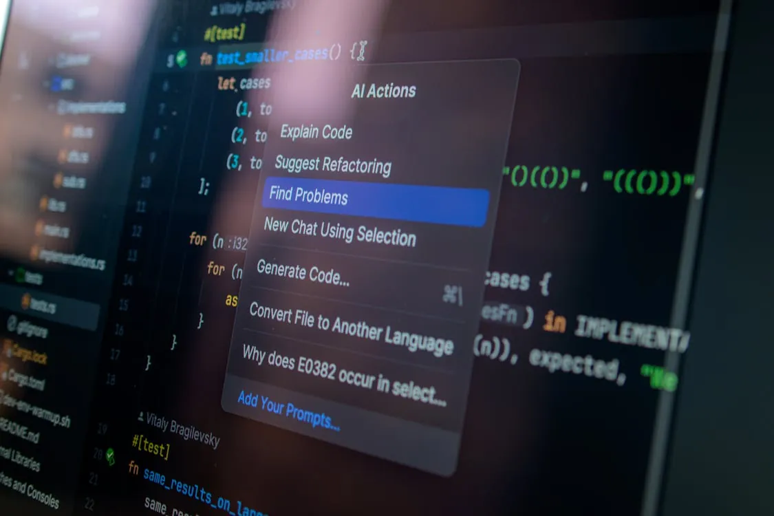 This photo shows a computer screen displaying a code editor with a contextual menu offering AI-driven options such as explaining code, suggesting refactoring, and finding problems. It is relevant for articles about programming, AI-assisted coding tools, or software development workflows.