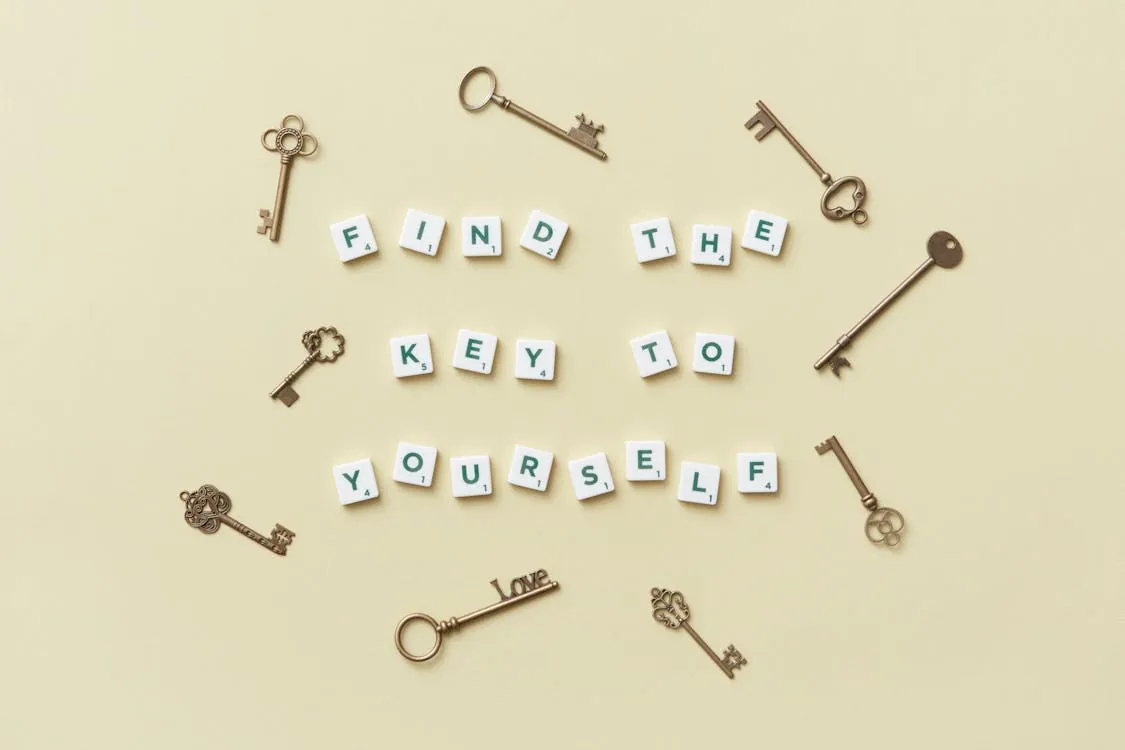 This image shows the phrase "Find the key to yourself" spelled out with letter tiles, surrounded by various vintage-style keys on a light-colored background, suggesting a theme of self-discovery and unlocking inner potential. It would be suitable for articles about personal growth, mindfulness, or finding one's true self.