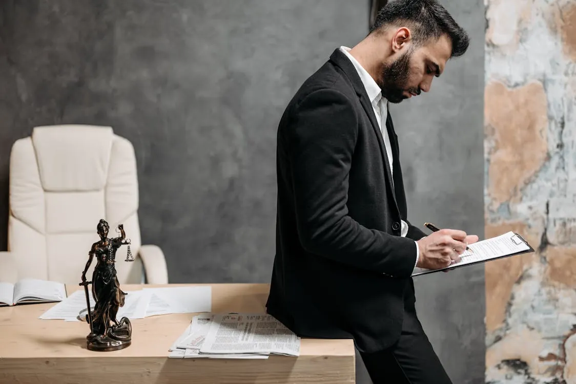 Professional at computer reviewing legal documents for AI automation workflow