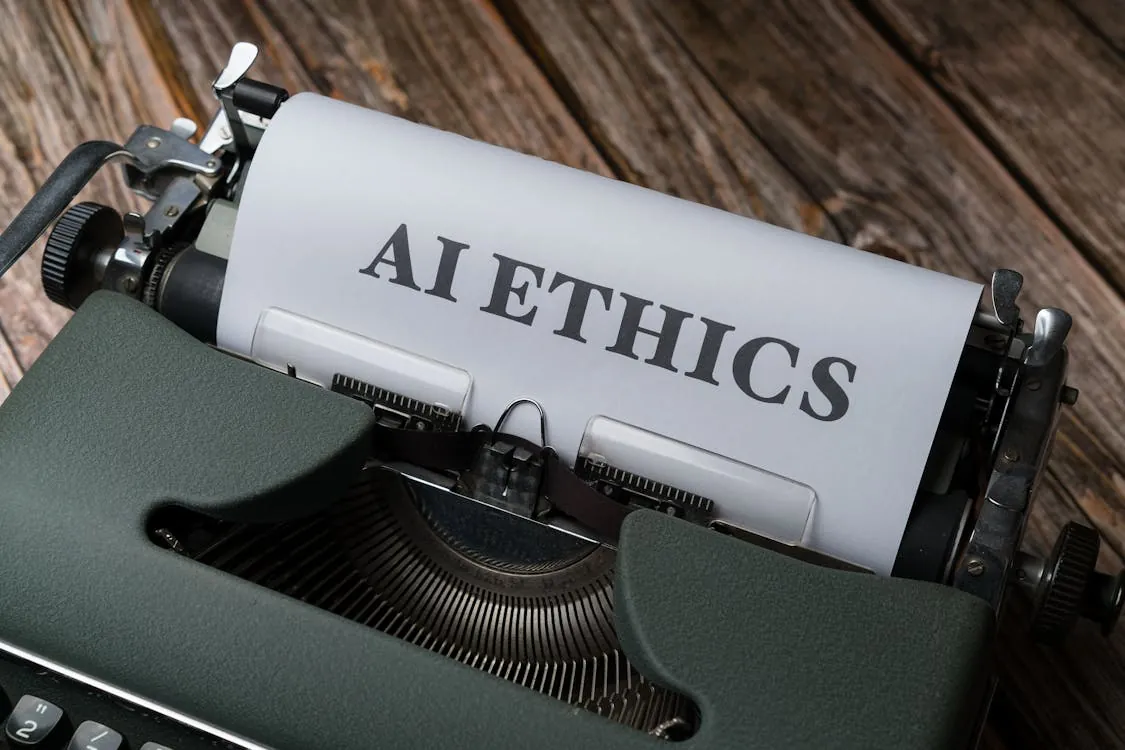 This photo features a vintage typewriter with a sheet of paper displaying the word "AI ETHICS," set against a rustic wooden background. It emphasizes the intersection of technology and moral considerations, making it suitable for articles discussing ethical issues in artificial intelligence.