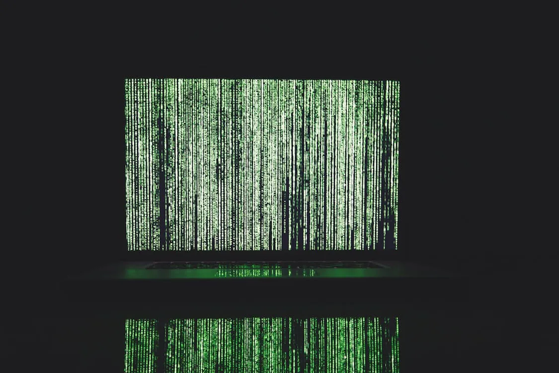 Abstract depiction of green matrix code on computer monitor