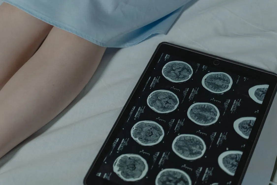 Healthcare professional using tablet to assess AI-generated diagnostic confidence