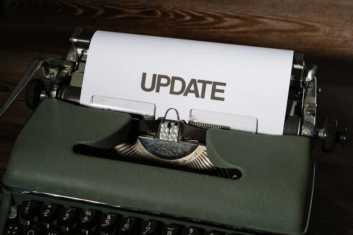 Vintage typewriter typing 'UPDATE', symbolizing technology updates