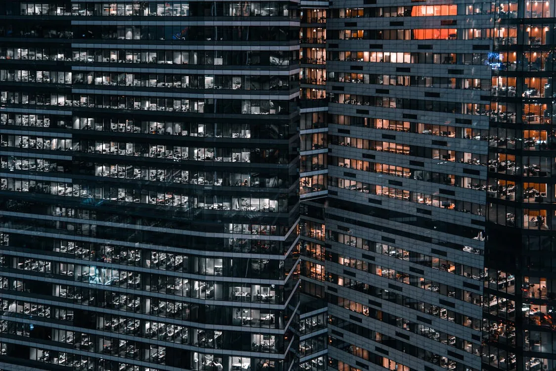 Modern corporate office buildings representing corporate restructuring and business change