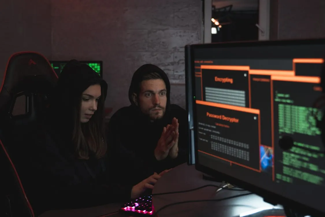 Cybersecurity incident response team monitoring screens