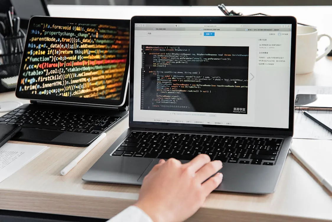developer working with multiple programming languages on laptop