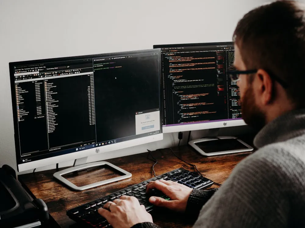 Software developer working on desktop Kanban app with multiple parallel tasks