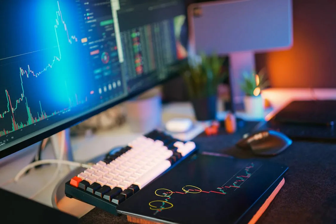 Digital asset trading desk with multiple financial data screens