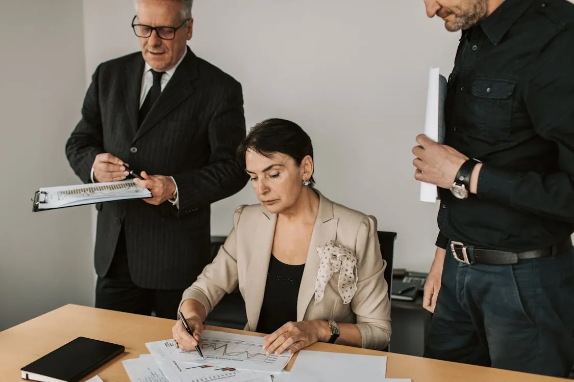 Financial compliance professionals in a meeting