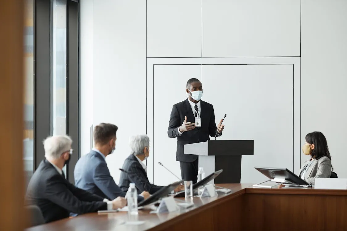Professionals in a meeting discussing fintech compliance and regulation