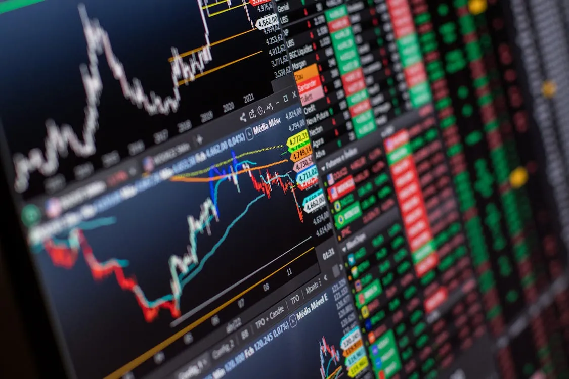 Stock market charts on screen for global markets and commodities coverage