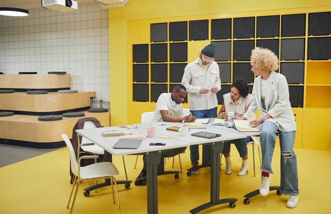 Modern office with diverse team collaborating on innovation