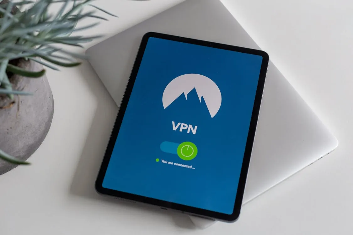 Security engineer auditing VPN network logs on screen