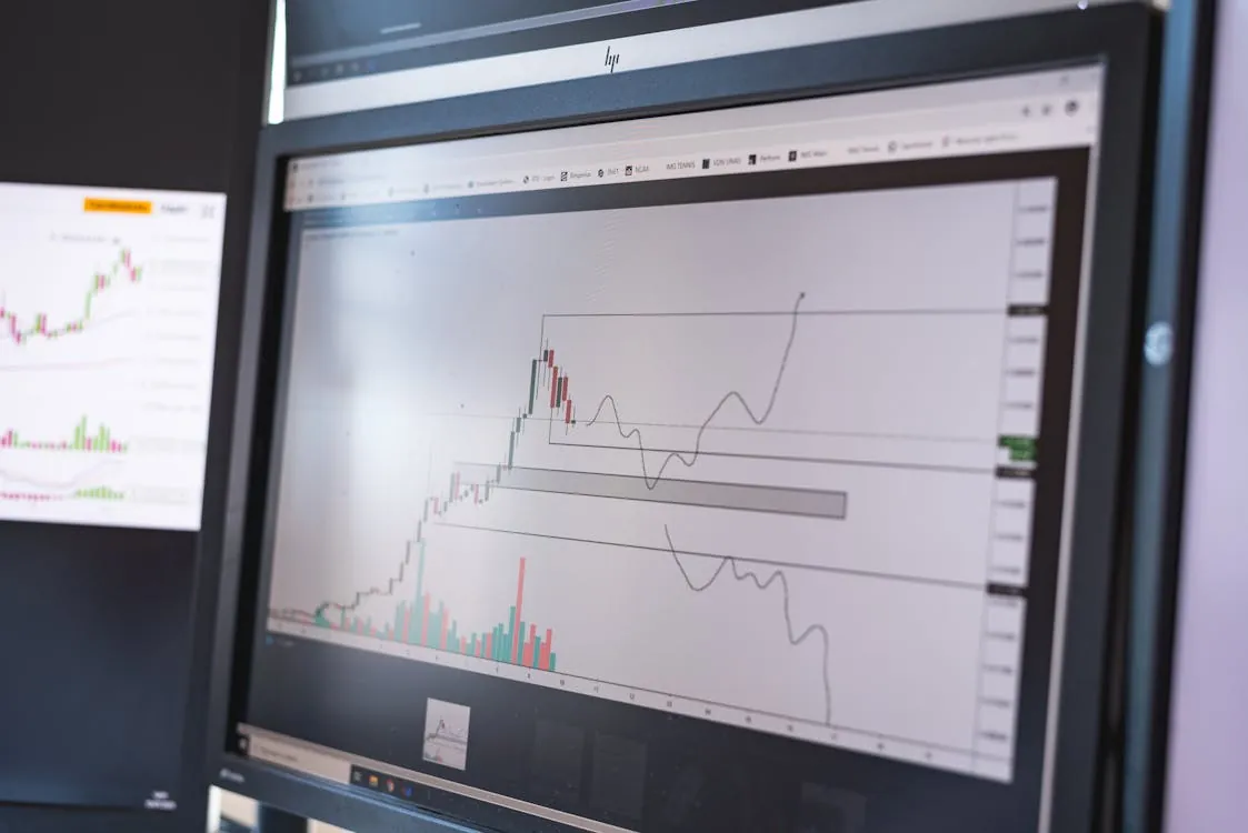 Stock market trading floor with traders and market screens