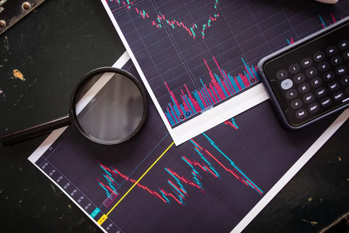 Financial charts and business district for Alibaba investor outlook