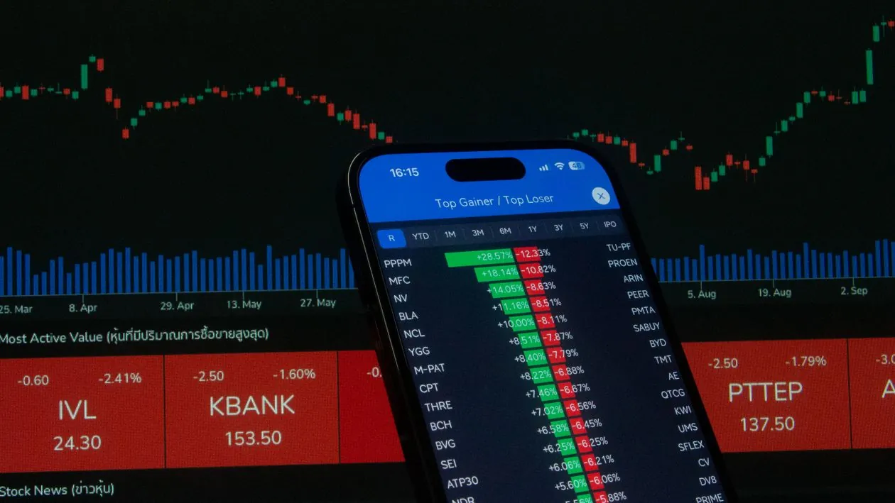 Financial market screens showing stock charts for investor stock report