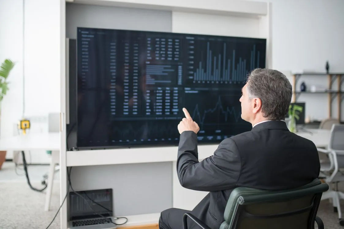 Cloud SaaS economics dashboard in a professional office setting