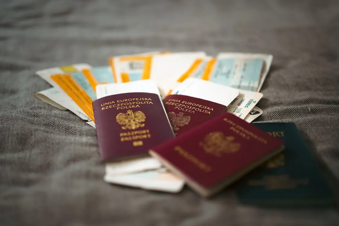 Family passports and travel documents spread on table