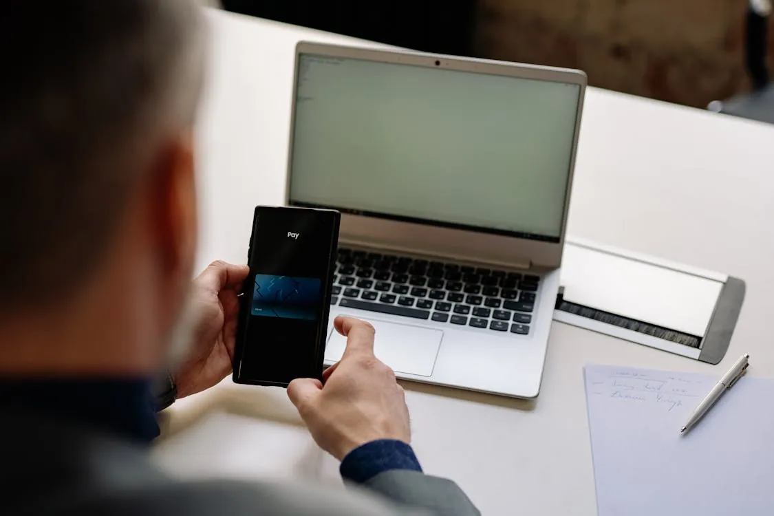 Fintech startup team reviewing digital payments data in office