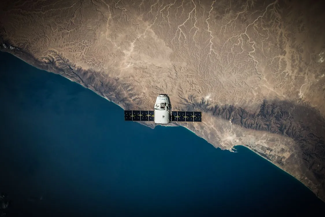 Satellite in orbit above Earth monitoring GPS signals