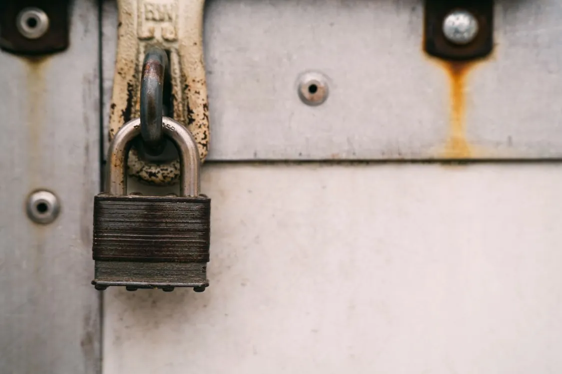 Padlock on server rack in technology data center