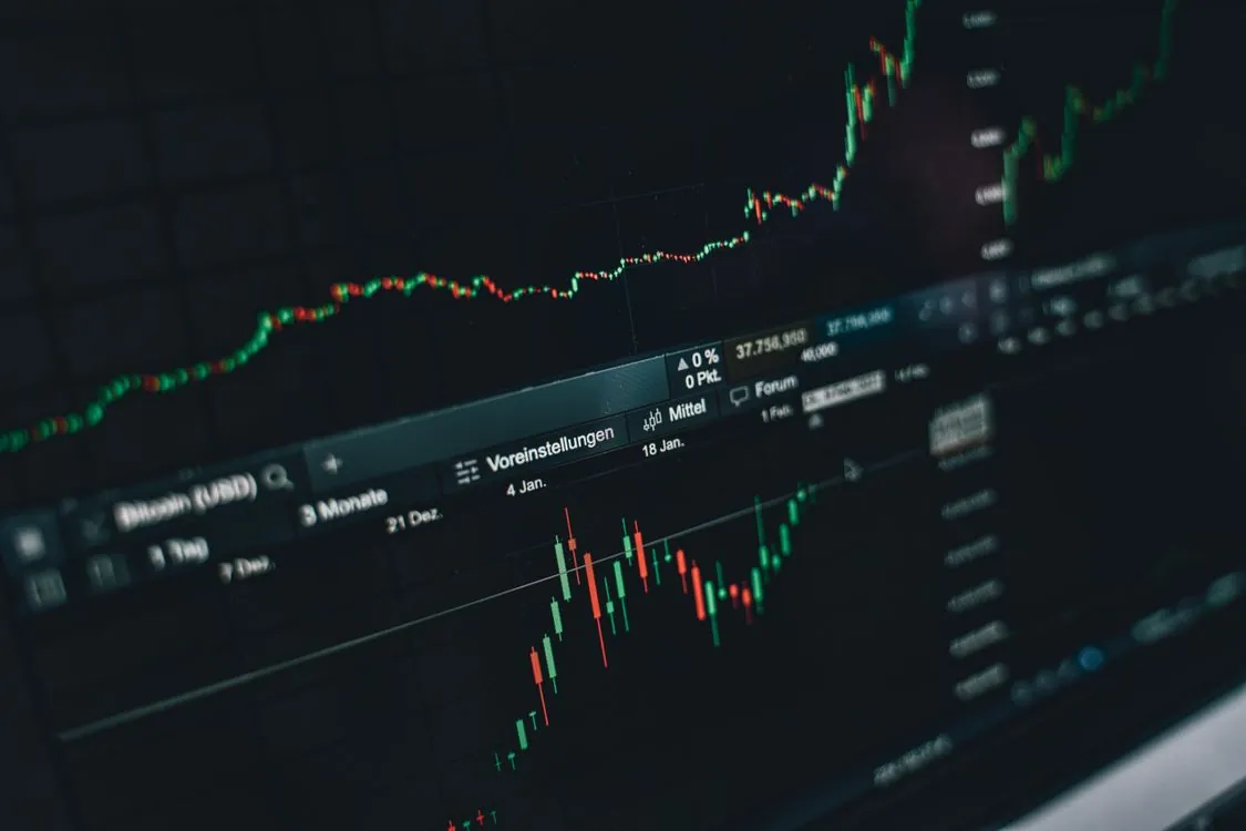 Trading screens showing financial market charts and data