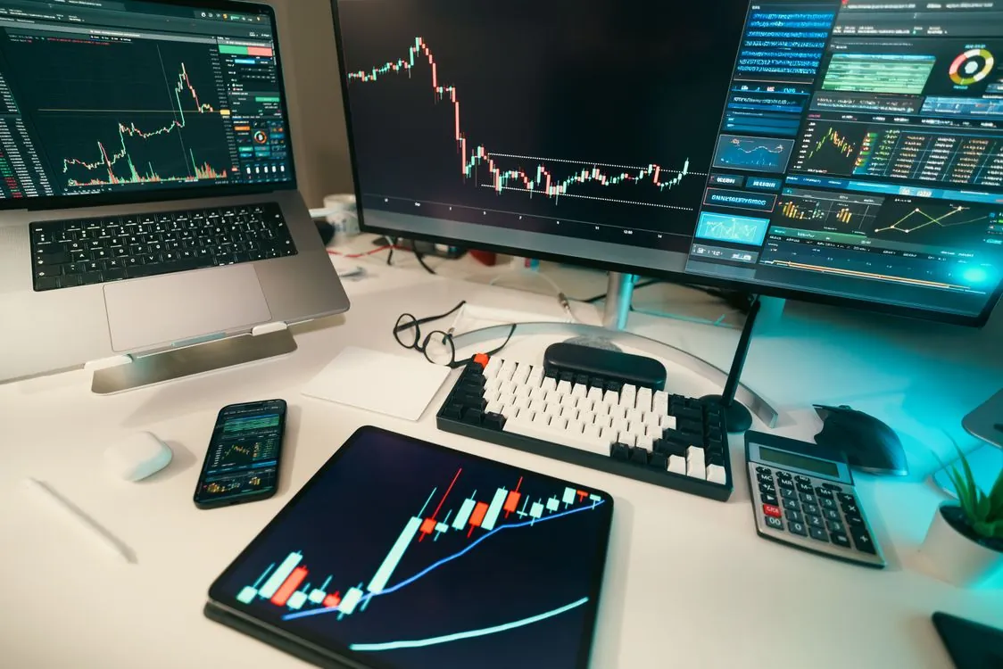 Cryptocurrency market charts on a trading desk