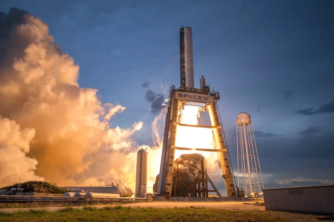 SpaceX rocket launching into space with satellite deployment mission