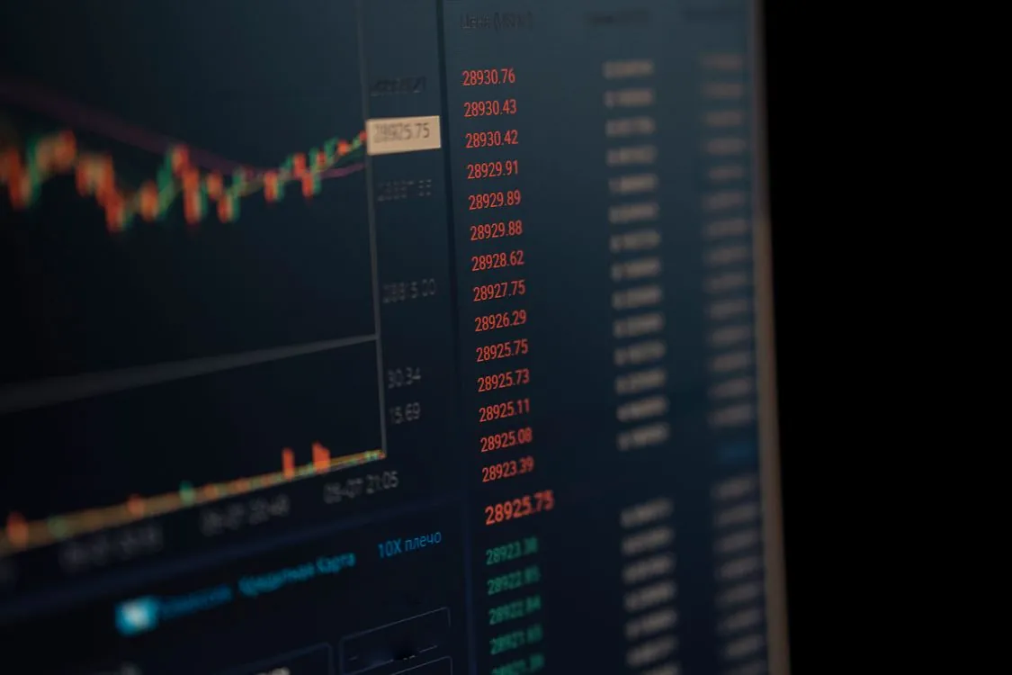 Trading screens showing market charts