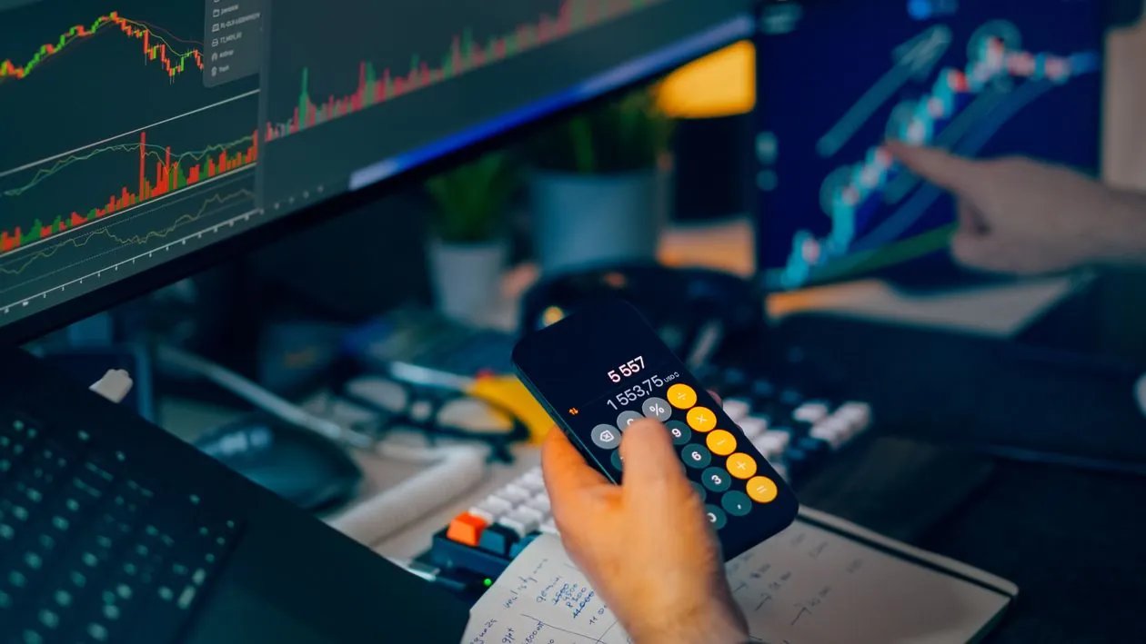 Trading screens representing market implications of AI infrastructure spending in 2026
