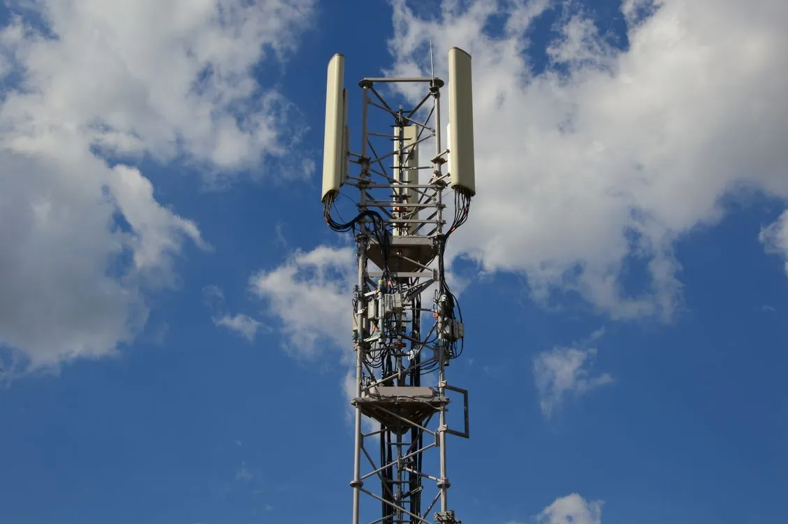 Wireless communication tower representing UHF technology in AI systems