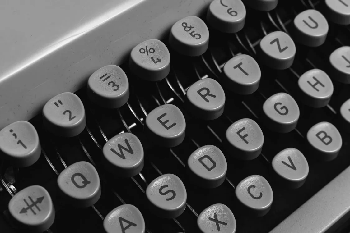 Close up of vintage typewriter keyboard showing number sign key