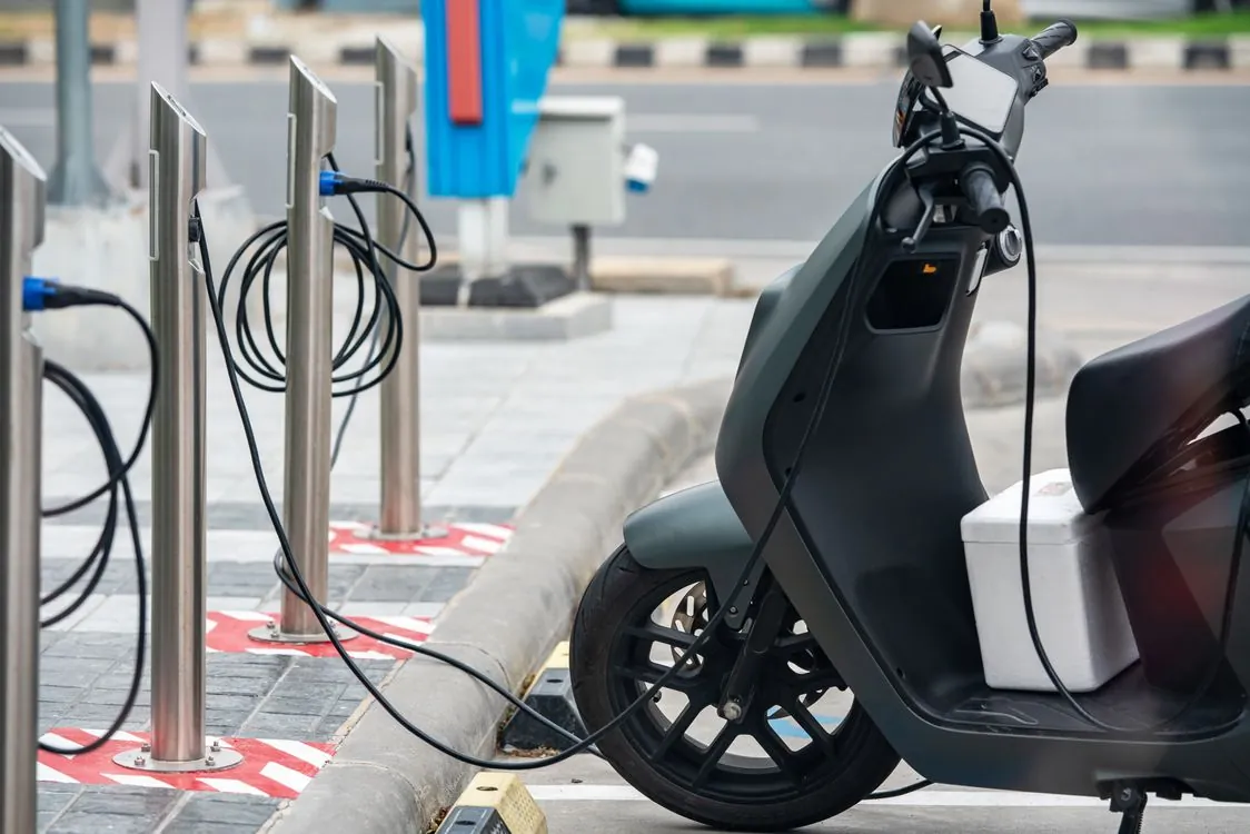 Electric vehicle charging station in urban setting
