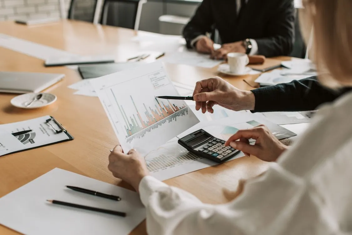 Engineering and finance team reviewing infrastructure budget charts