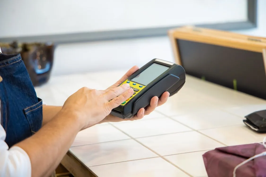 POS terminal and mobile payment in Chinese shop