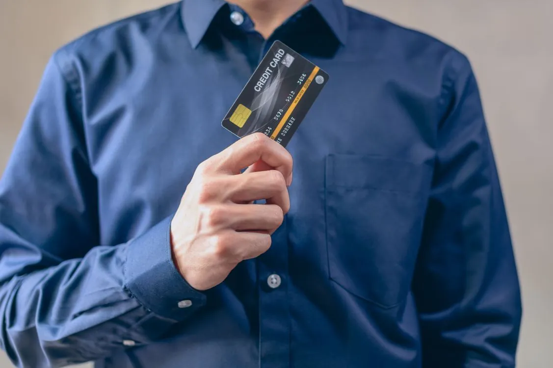 Payment card terminal with security lock representing PCI DSS compliance