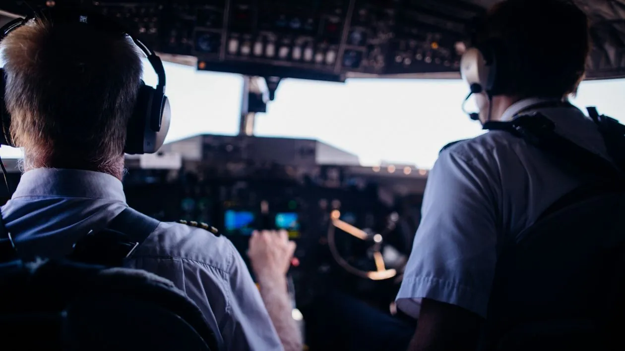 Pilots in cockpit of modern airplane