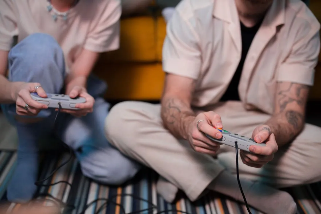 Person playing classic retro games on a laptop computer