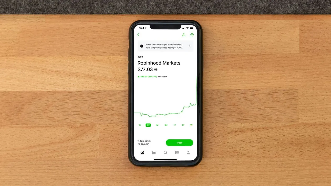 Smartphone showing a Robinhood-style stock trading platform, representing Robinhood brokerage, cryptocurrency, margin and subscription products