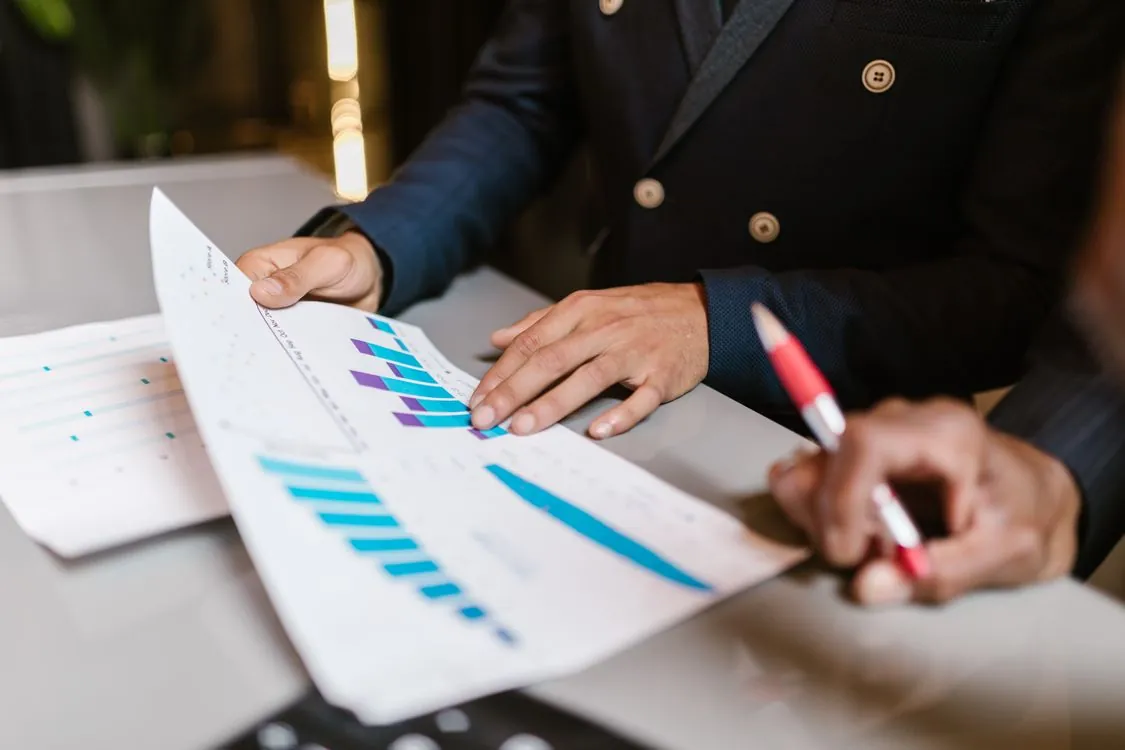 People reviewing analytics charts and dashboards in a meeting