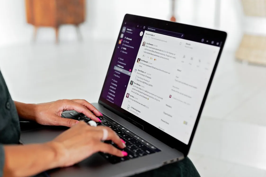 Business messaging app on a laptop in an office setting