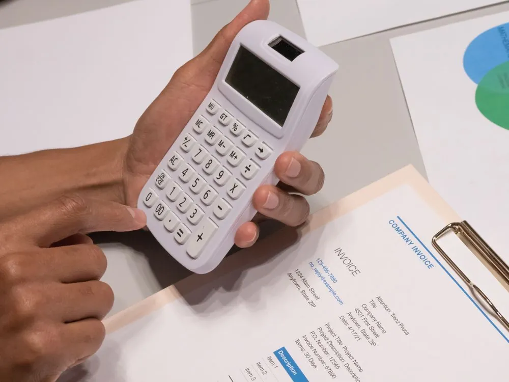 Calculating payment transaction fees on a calculator with documents