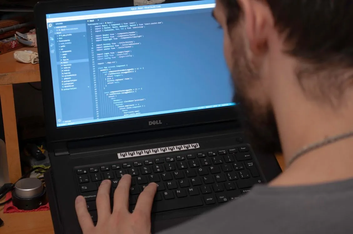 Developer evaluating open source alternatives on a laptop