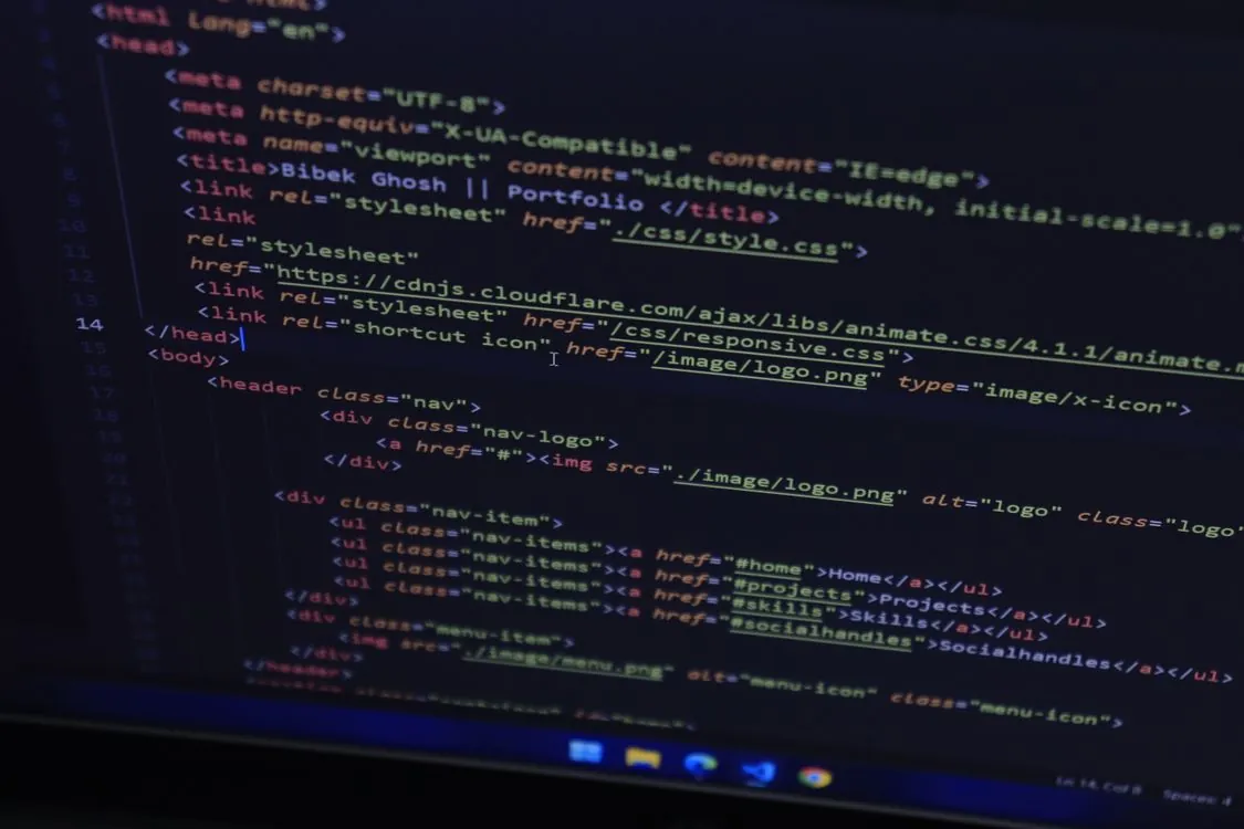 Close-up of developer workstation with code on screen